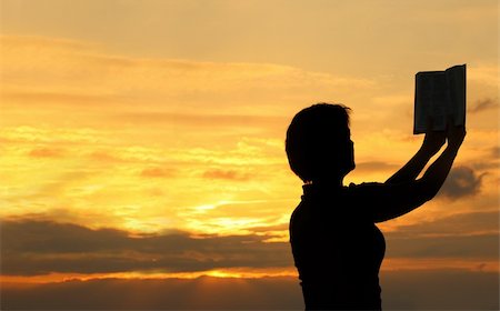 simsearch:400-05065940,k - female praying with bible against summer sunset, person isn't identifable Stock Photo - Budget Royalty-Free & Subscription, Code: 400-04538358