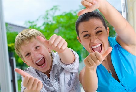 simsearch:400-03952911,k - Portrait of young boy with his sister  giving their  thumbs up Stock Photo - Budget Royalty-Free & Subscription, Code: 400-04538526