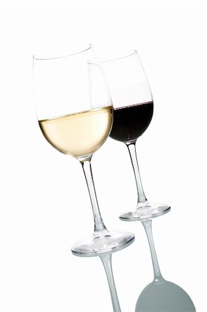 simsearch:400-04538167,k - Two glasses of wine. White and Red. Isolated on white background. Photographie de stock - Aubaine LD & Abonnement, Code: 400-04538663