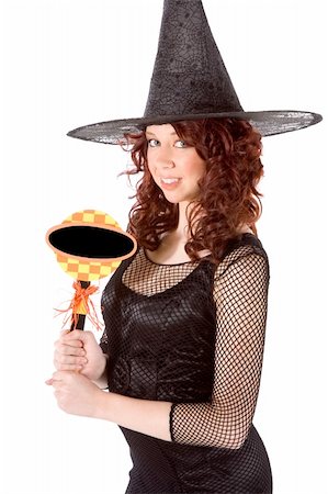 simsearch:400-04028019,k - Portrait of Hispanic teenager girl in black Halloween hat and fishnet dress holding blank black sign Foto de stock - Super Valor sin royalties y Suscripción, Código: 400-04539215