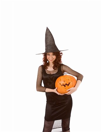 simsearch:400-04028019,k - Portrait of young Hispanic woman in black Halloween costume (fishnet dress) holding carved pumpkin (jack-o'-lantern) in hands Foto de stock - Super Valor sin royalties y Suscripción, Código: 400-04539213