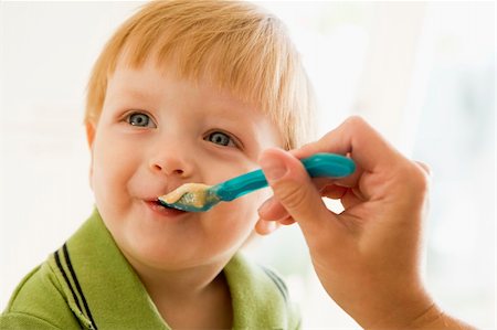 simsearch:400-04044714,k - Mother feeding young boy baby food Stock Photo - Budget Royalty-Free & Subscription, Code: 400-04539424