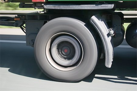 simsearch:400-06069419,k - Big blurred lorry wheel on the move - seen on a german Autobahn Stock Photo - Budget Royalty-Free & Subscription, Code: 400-04539609