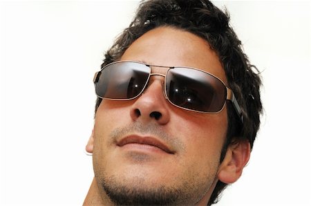 Portrait of young trendy male model wearing sunglasses isolated Stock Photo - Budget Royalty-Free & Subscription, Code: 400-04539816
