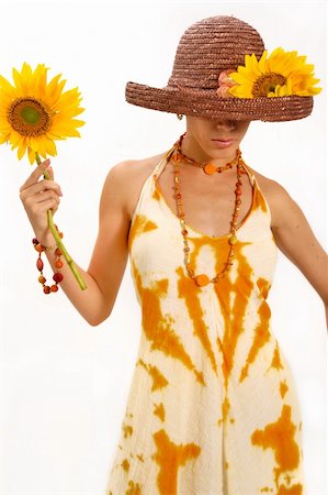 simsearch:400-05092676,k - Portrait of young trendy female holding sunflower in summer fashion clothes - isolated Stock Photo - Budget Royalty-Free & Subscription, Code: 400-04539825