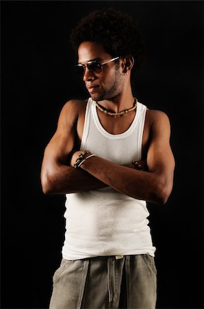 simsearch:400-04163139,k - Portrait of young trendy african man posing with attitude Photographie de stock - Aubaine LD & Abonnement, Code: 400-04539839