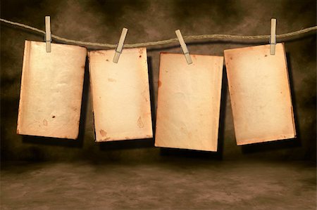 simsearch:400-04813897,k - Distressed Stained Old Work Book Open For Your Text or Designs Hanging on a Rope By Clothespins Stock Photo - Budget Royalty-Free & Subscription, Code: 400-04539892