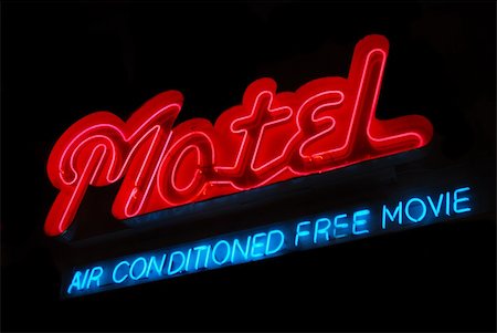 Illuminated motel neon sign with air conditioning and free movie Stock Photo - Budget Royalty-Free & Subscription, Code: 400-04539950