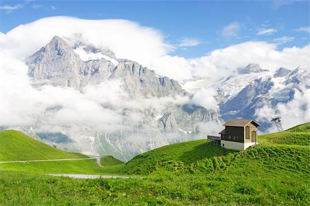switzerland people on road - Swiss Mountains. Jungfrau covered in clouds, Jungfrau region, Switzerland Stock Photo - Budget Royalty-Free & Subscription, Code: 400-04530016