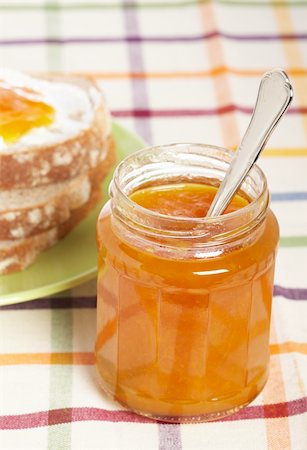 simsearch:400-05079087,k - Toast with butter and peach jam glass jar in the green plate with soft shadow on square mat background. Shallow depth of field Stock Photo - Budget Royalty-Free & Subscription, Code: 400-04530161
