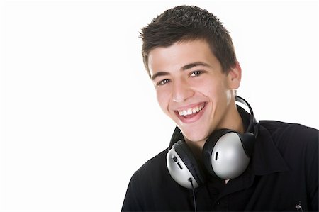 Portrait of a happy young man smiling, with headphones. Stock Photo - Budget Royalty-Free & Subscription, Code: 400-04531088
