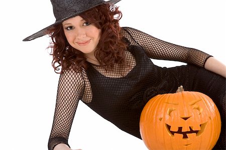 simsearch:400-04007612,k - Portrait of Hispanic teenager girl in black Halloween hat and fishnet dress with carved pumpkin (Jack O' Lantern) Stock Photo - Budget Royalty-Free & Subscription, Code: 400-04532001