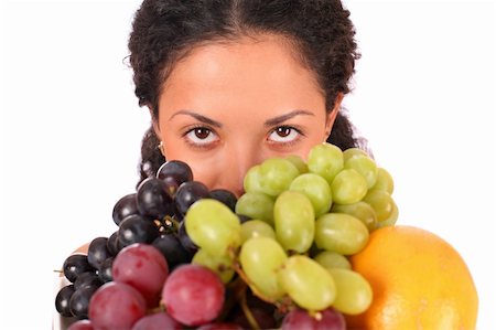 photo of model woman with grapes - A woman holds a plate with different kinds of fruits in her hands, standing on white background. Stock Photo - Budget Royalty-Free & Subscription, Code: 400-04532014