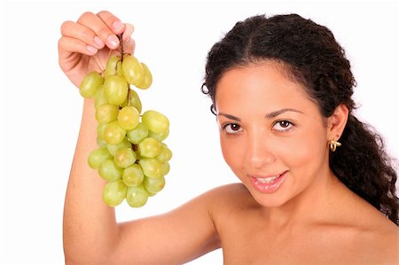 photo of model woman with grapes - A smiling woman holds a bunch of green grapes, standing on white background. Stock Photo - Budget Royalty-Free & Subscription, Code: 400-04532016