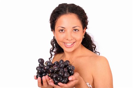 photo of model woman with grapes - A smiling, happy woman holds two bunches of grapes in her hands, standing on white background. Stock Photo - Budget Royalty-Free & Subscription, Code: 400-04532018