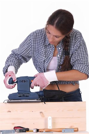 female builders carpentry - woman carpenter at work on white background Stock Photo - Budget Royalty-Free & Subscription, Code: 400-04532186