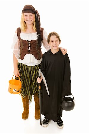 Big sister ready to take her little brother trick or treating on Halloween.  Full body isolated on white. Stock Photo - Budget Royalty-Free & Subscription, Code: 400-04532419