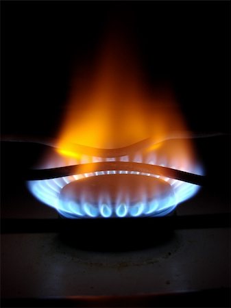 simsearch:400-04913476,k - Blue flames of gas stove in the dark Photographie de stock - Aubaine LD & Abonnement, Code: 400-04532412