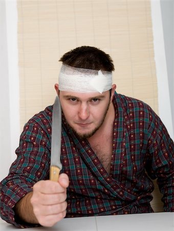 simsearch:600-03490321,k - sick crazy man with kitchen knife Photographie de stock - Aubaine LD & Abonnement, Code: 400-04532500