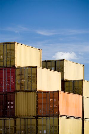 sascha (artist) - shipping freight containers stacked in port against blue sky Fotografie stock - Microstock e Abbonamento, Codice: 400-04532827