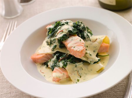 simsearch:400-04031652,k - Plate of Open Lasagne of Salmon and Spinach with a Saffron Cream with cutlery Stock Photo - Budget Royalty-Free & Subscription, Code: 400-04532909