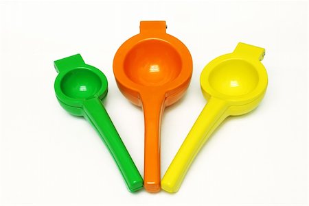 squeezer - Lime, Orange, and Lemon squeezers on white background Foto de stock - Super Valor sin royalties y Suscripción, Código: 400-04532901