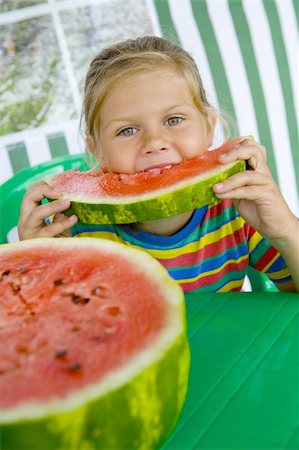 simsearch:400-06177351,k - Little blond girl with a piece of watermelon in her hands Stock Photo - Budget Royalty-Free & Subscription, Code: 400-04532927