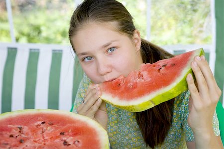 simsearch:400-05014700,k - Long hair teen girl with a piece of watermelon in her hands Fotografie stock - Microstock e Abbonamento, Codice: 400-04532929