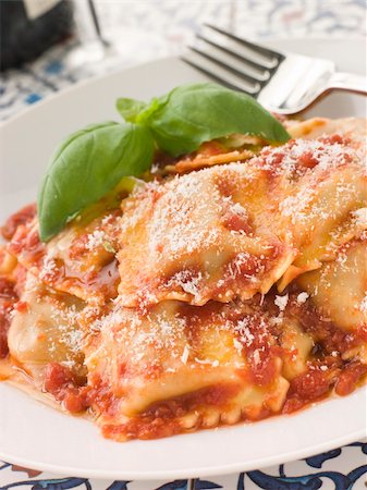 simsearch:400-04031652,k - Plate of Veal and Sage Ravioli with Tomato and Basil Sauce with Grated Parmesan Stock Photo - Budget Royalty-Free & Subscription, Code: 400-04532930