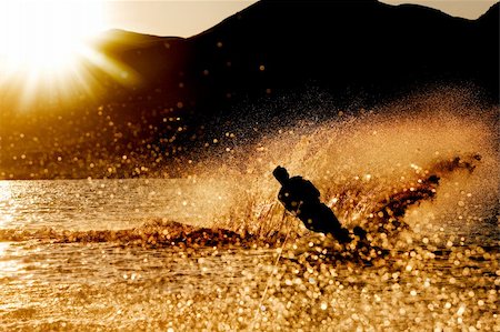 A male waterskiing in the evening sunset Stock Photo - Budget Royalty-Free & Subscription, Code: 400-04532952