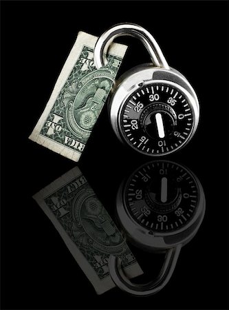 Dollar bill locked by combination lock on black background with reflection. Stock Photo - Budget Royalty-Free & Subscription, Code: 400-04533129