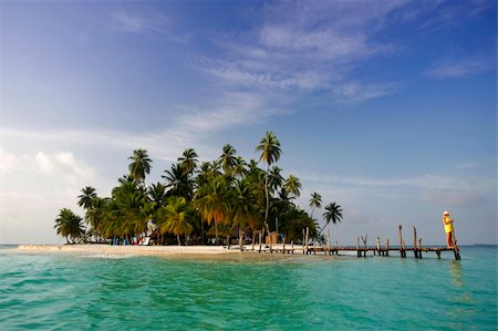 Woman on a tropical island jetty Fotografie stock - Microstock e Abbonamento, Codice: 400-04533496