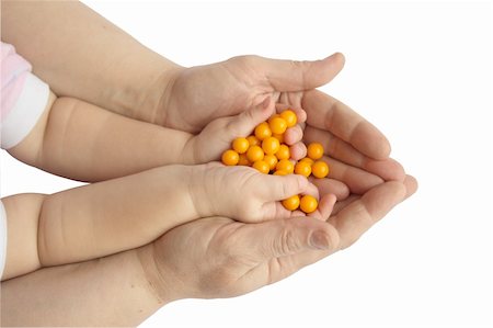 simsearch:400-05074416,k - Female and child  hands with yellow tablets Photographie de stock - Aubaine LD & Abonnement, Code: 400-04533746