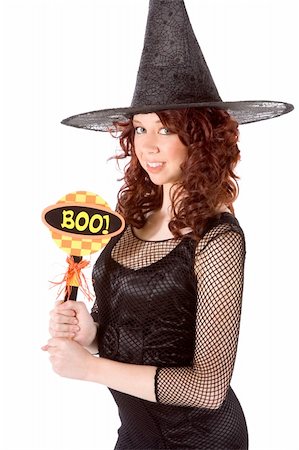 simsearch:400-04007612,k - Portrait of Hispanic teenager girl in black Halloween hat and fishnet dress holding "boo!" sign Stock Photo - Budget Royalty-Free & Subscription, Code: 400-04533829