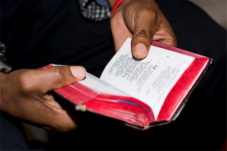 Two hands holding an old, well-used prayer book at a Methodist church service on Sunday are symbolic of faith of South African people. Note: shallow depth of field is focused on just the thumb and the nearby text. Stock Photo - Budget Royalty-Free & Subscription, Code: 400-04544182