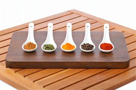 simsearch:400-06919406,k - Assortment of spices in the spoons for prepare tasty food with soft shadow in the wooden background. Shallow depth of field Foto de stock - Royalty-Free Super Valor e Assinatura, Número: 400-04544253