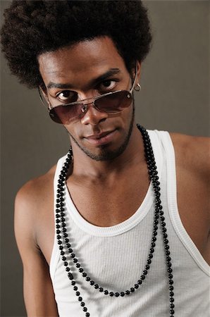 simsearch:400-05080882,k - Portrait of young trendy latino man wearing fashion sunglasses Photographie de stock - Aubaine LD & Abonnement, Code: 400-04544373