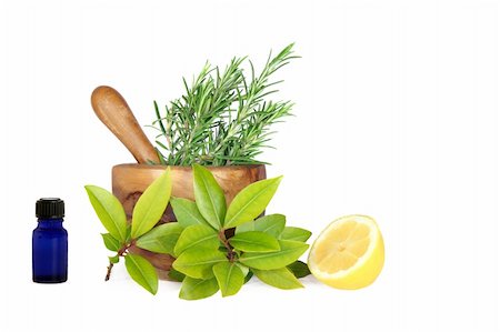 simsearch:400-04544414,k - Fresh herb selection of rosemary, bay leaves and half a lemon with essential oil blue glass aromatherapy bottle and an olive wood pestle and mortar to the rear, over white background. Stock Photo - Budget Royalty-Free & Subscription, Code: 400-04544414