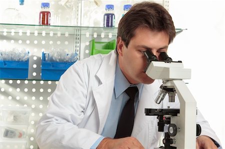 simsearch:400-05670478,k - A researcher observes a substance on a slide under a stereo microscope Stock Photo - Budget Royalty-Free & Subscription, Code: 400-04544973