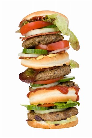 a home made quadruple hamburger isolated on white background Foto de stock - Super Valor sin royalties y Suscripción, Código: 400-04545264