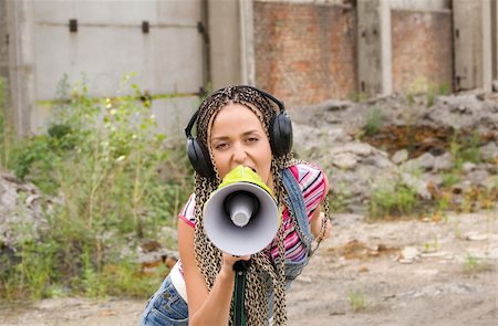 dreads teen - Beautiful girl singing with the megaphone Stock Photo - Budget Royalty-Free & Subscription, Code: 400-04545428