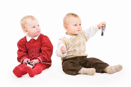 two children on the floor with phones Stock Photo - Budget Royalty-Free & Subscription, Code: 400-04545642