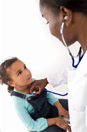 A female African American doctor using her stethoscope to examine a mixed race little girl Stock Photo - Budget Royalty-Free & Subscription, Code: 400-04545669