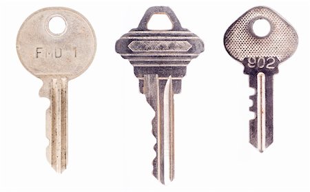 Three different, semi modern keys isolated on a white background. Stockbilder - Microstock & Abonnement, Bildnummer: 400-04545887