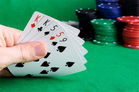 simsearch:400-04672615,k - A poker hand with two pair and chips in the background Stock Photo - Budget Royalty-Free & Subscription, Code: 400-04545899