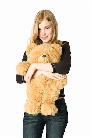 Young girl hugging a teddy bear, isolated Stock Photo - Budget Royalty-Free & Subscription, Code: 400-04545987