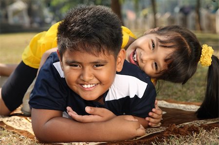 Two kids having fun playing Stock Photo - Budget Royalty-Free & Subscription, Code: 400-04546036