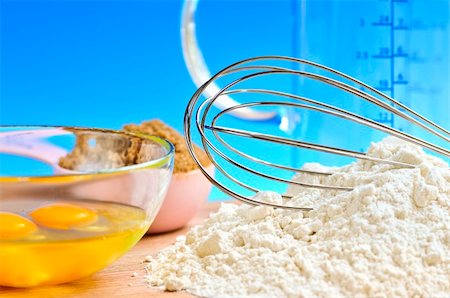 Flour, whisk and eggs in a bowl, baking ingredients Stock Photo - Budget Royalty-Free & Subscription, Code: 400-04546806