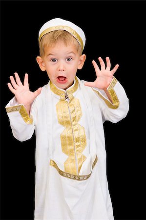 simsearch:400-04547844,k - An adorable little boy dressed in Arabian thobe, isolated on black. Stock Photo - Budget Royalty-Free & Subscription, Code: 400-04547844
