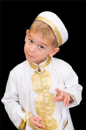 simsearch:400-04547844,k - An adorable little boy dressed in Arabian thobe, isolated on black. Stock Photo - Budget Royalty-Free & Subscription, Code: 400-04547843